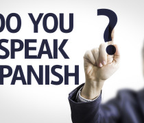 Business man pointing the text: Do you Speak Spanish?