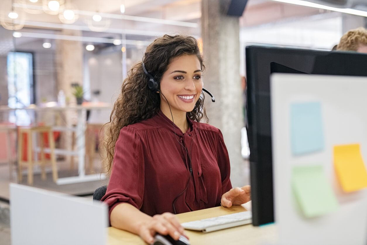 Happy Call Center Agent Working on Support Hotline in Office.