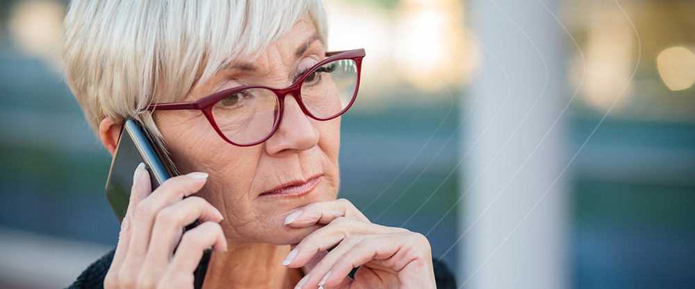 Woman Wearing Glasses Talking on a Cell Phone