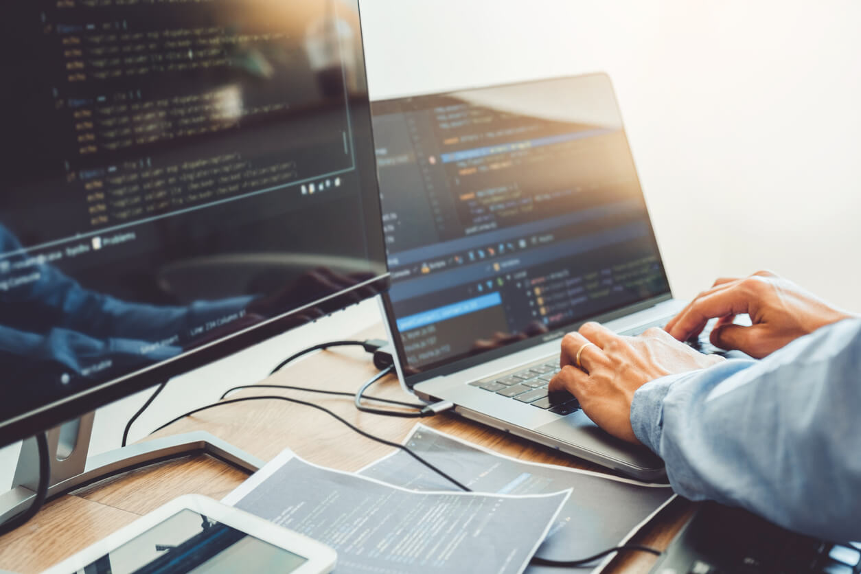 Office Worker Coding On His Work Laptop