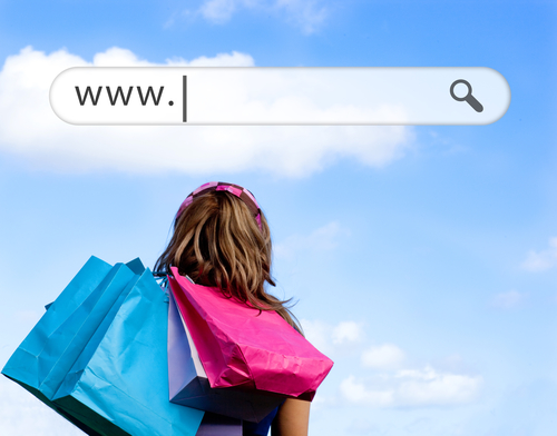 Caucasian woman holding shopping bags outdoor