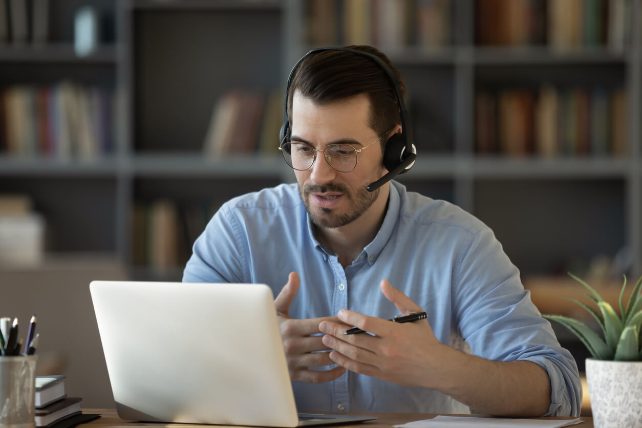 Man Having a Conversation Over the Internet