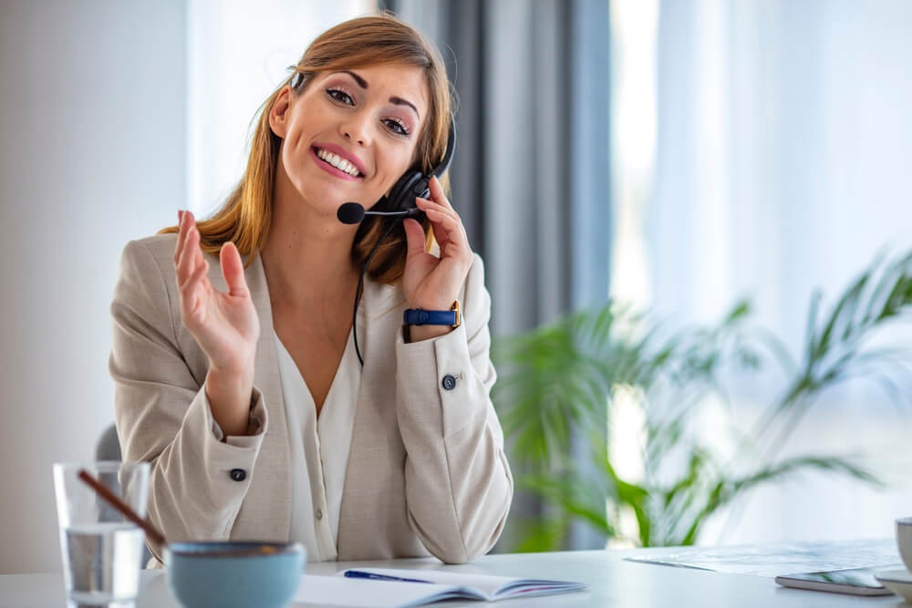 Customer Support Woman Smiling and Looking at Camera remote receptionist service